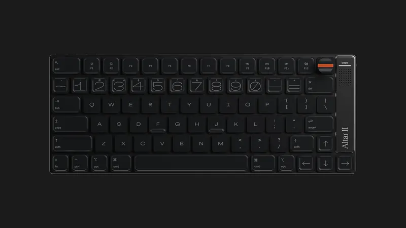 Top view of the black Electronic Materials Office Altar II keyboard with its orange M-Dial
