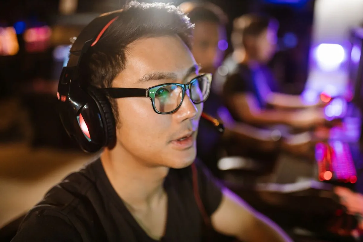 Concentrated esports player practicing to react faster and improve a slow reaction time