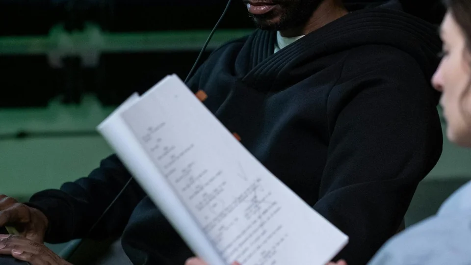 People using studio headphones while checking audio detail and playback quality