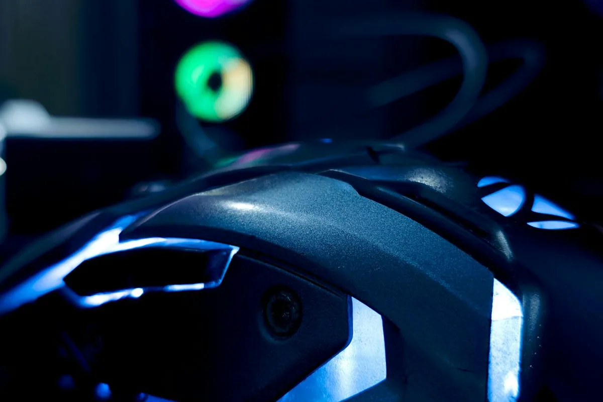 Close-up of an illuminated gaming mouse, used to discuss the high-DPI gaming myth
