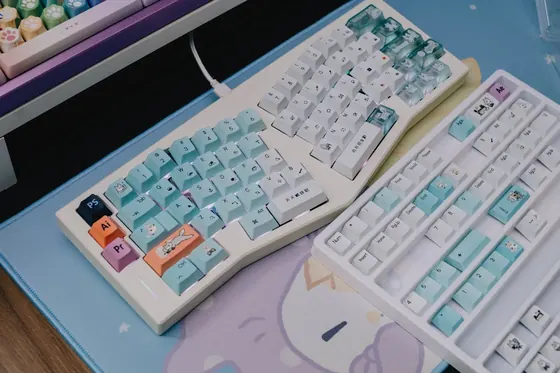 Two colourful custom mechanical keyboards with pastel keycaps — the V4N4G0N 45% custom keyboard aesthetic