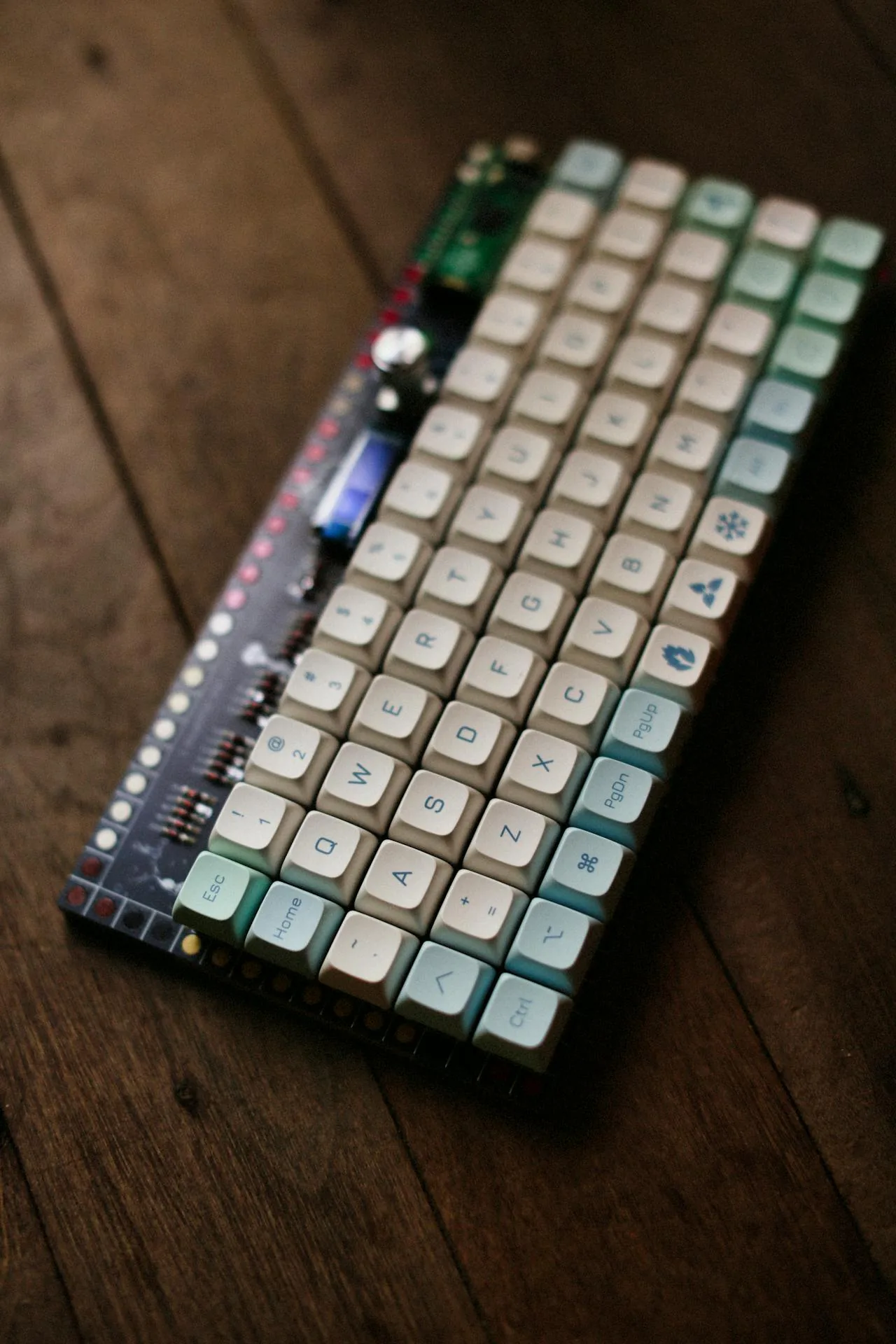 Custom mechanical keyboard with colorful keycaps on a wooden surface