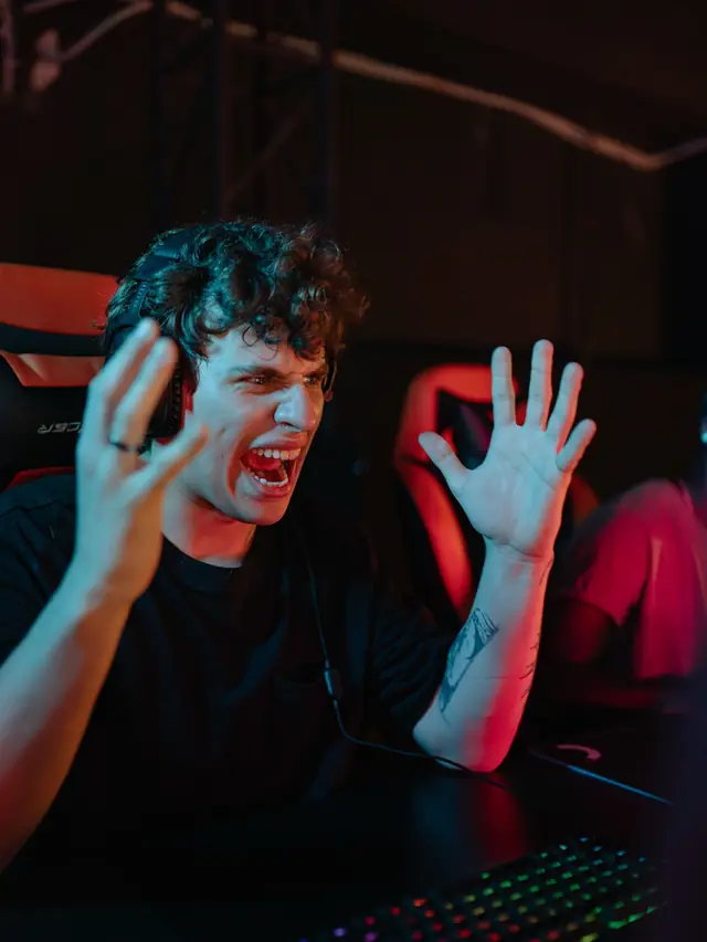 The recurring curly-haired gamer reacting during play; posed stock illustration of a buying decision, not a Rival Pro fault