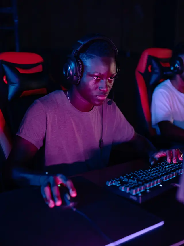A gamer with one hand on a mouse and the other on a keyboard; stock illustration of checking ordinary controls