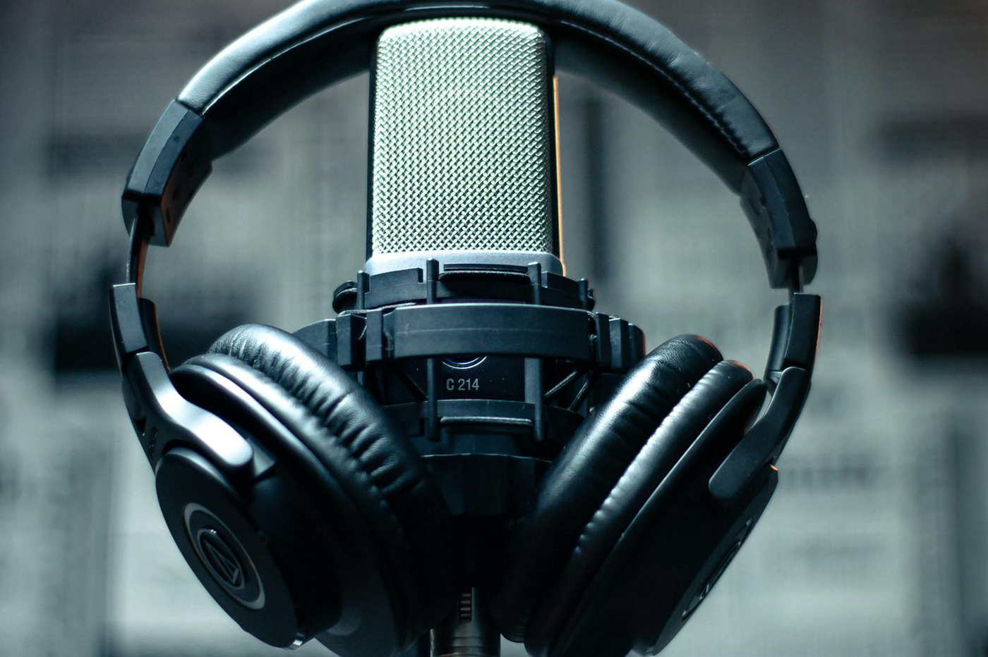 Person verifying stereo speaker and headphone output online with left and right channel controls